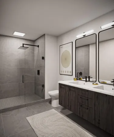 a spacious bathroom with a double vanity sink toilet mirror and shower