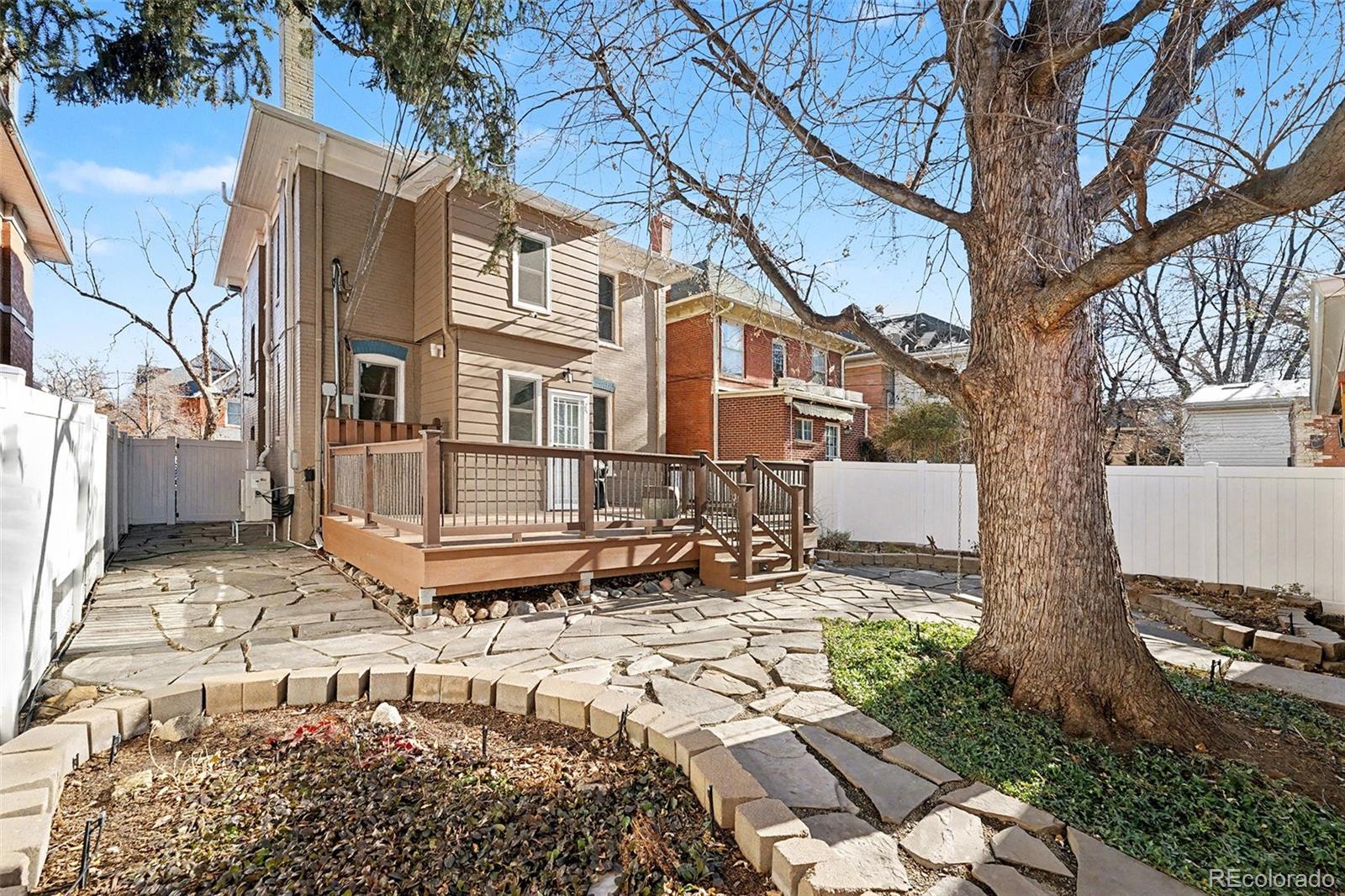 1419 Adams Street Denver, CO 80206 - Photo 33 of 34 a white bench sitting in front of a house