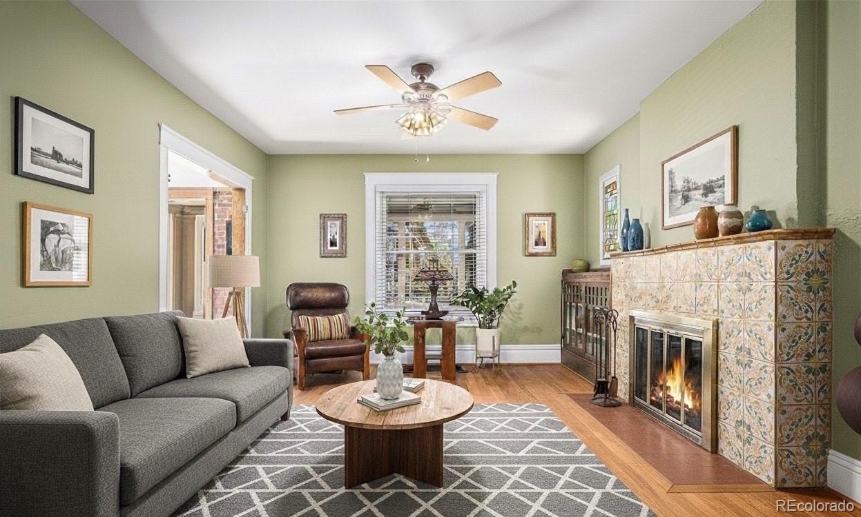 1419 Adams Street Denver, CO 80206 - Photo 5 of 34 a living room with furniture a fireplace and a window