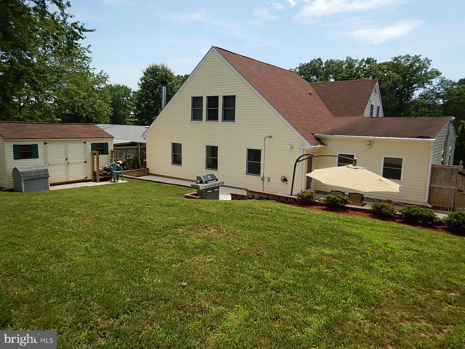 815 Ferguson Road Joppa, MD 21085 - Photo 21 of 37 Rear view of home, shed, and patio