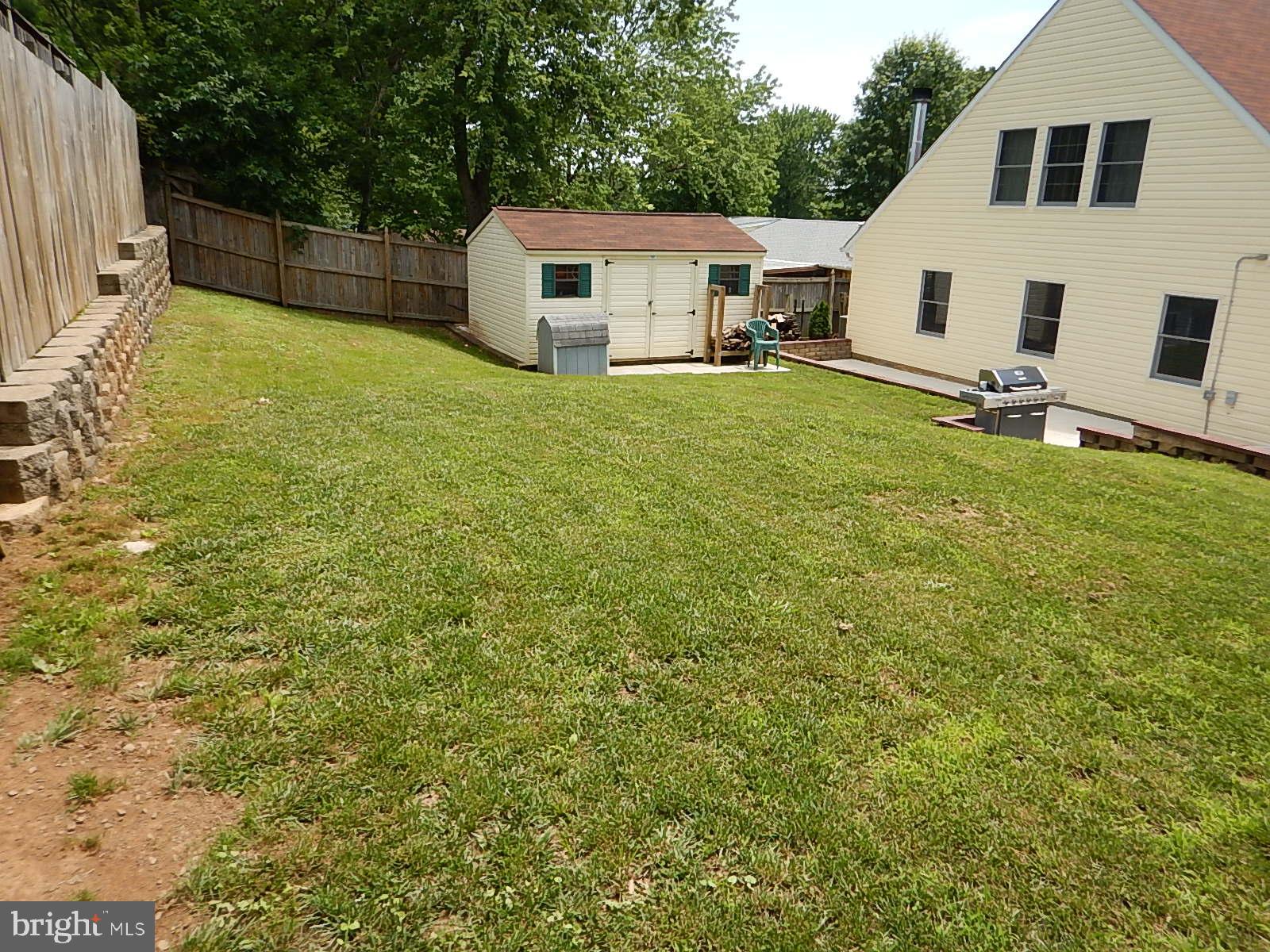 815 Ferguson Road Joppa, MD 21085 - Photo 22 of 37 Grassy area above patio