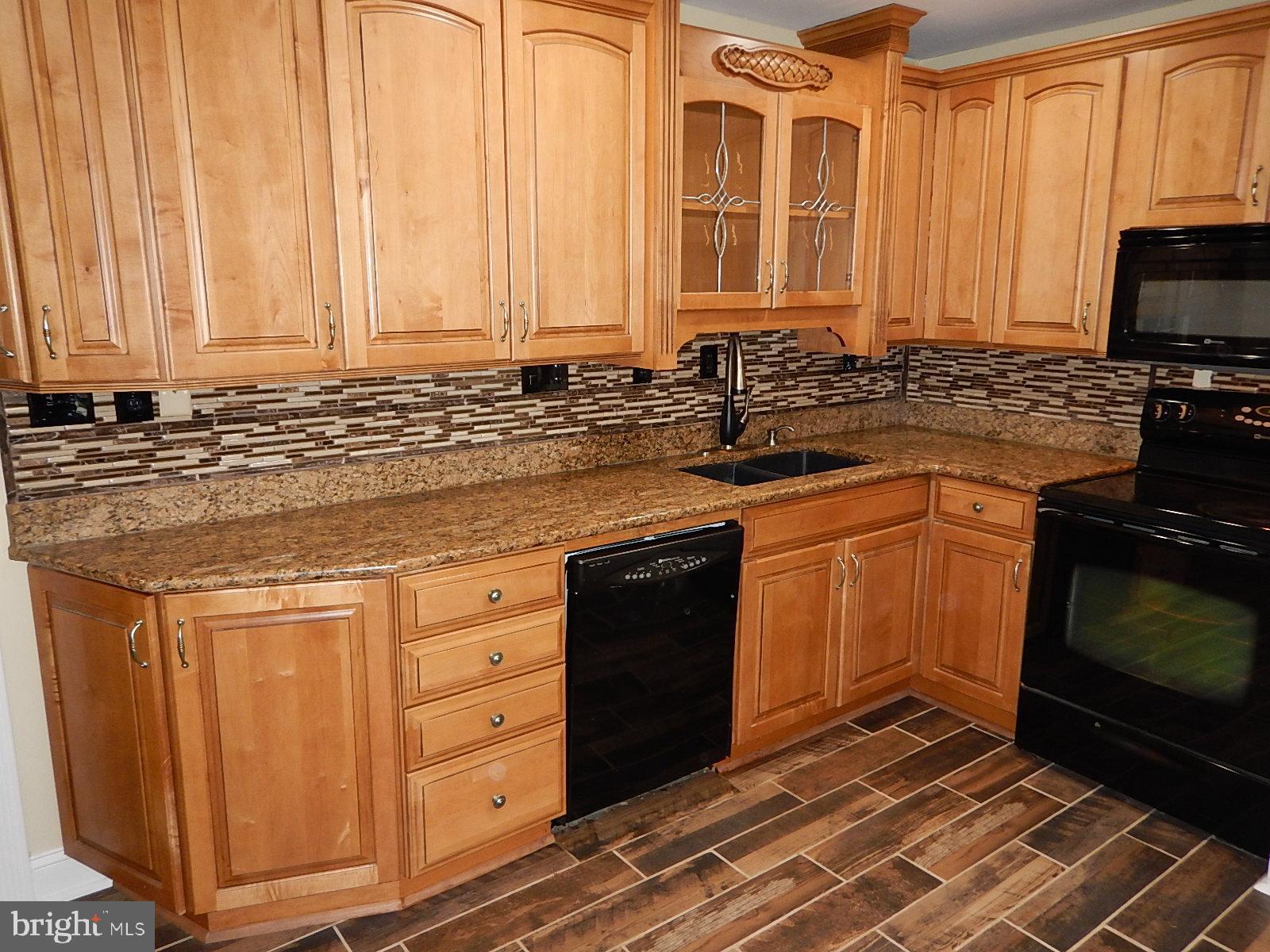 815 Ferguson Road Joppa, MD 21085 - Photo 9 of 37 Granite Counter, Ceramic Tile Floor, Backsplash
