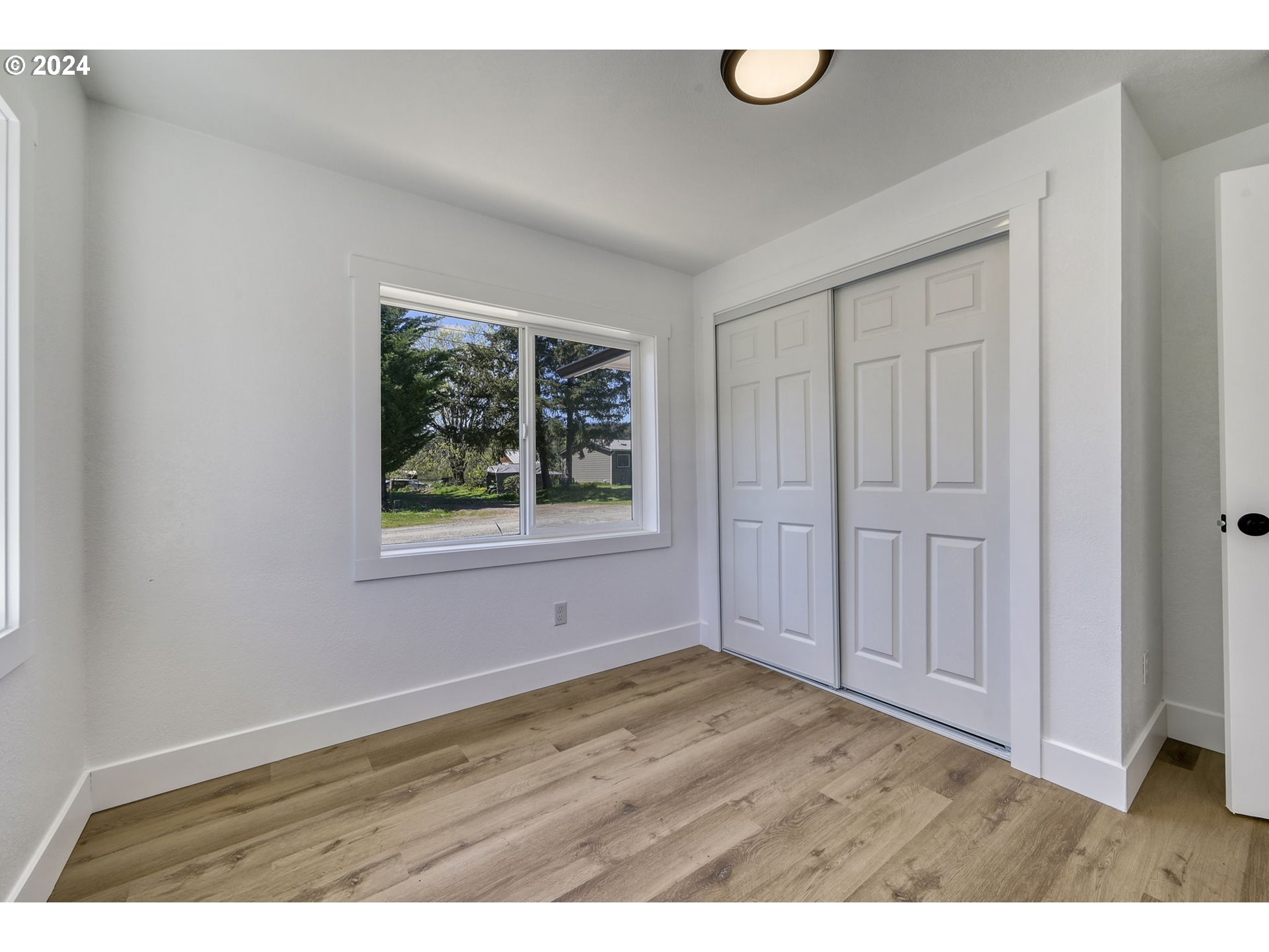 92045 Maple Lane Springfield, OR 97478 - Photo 11 of 21 a view of an empty room with window and closet area