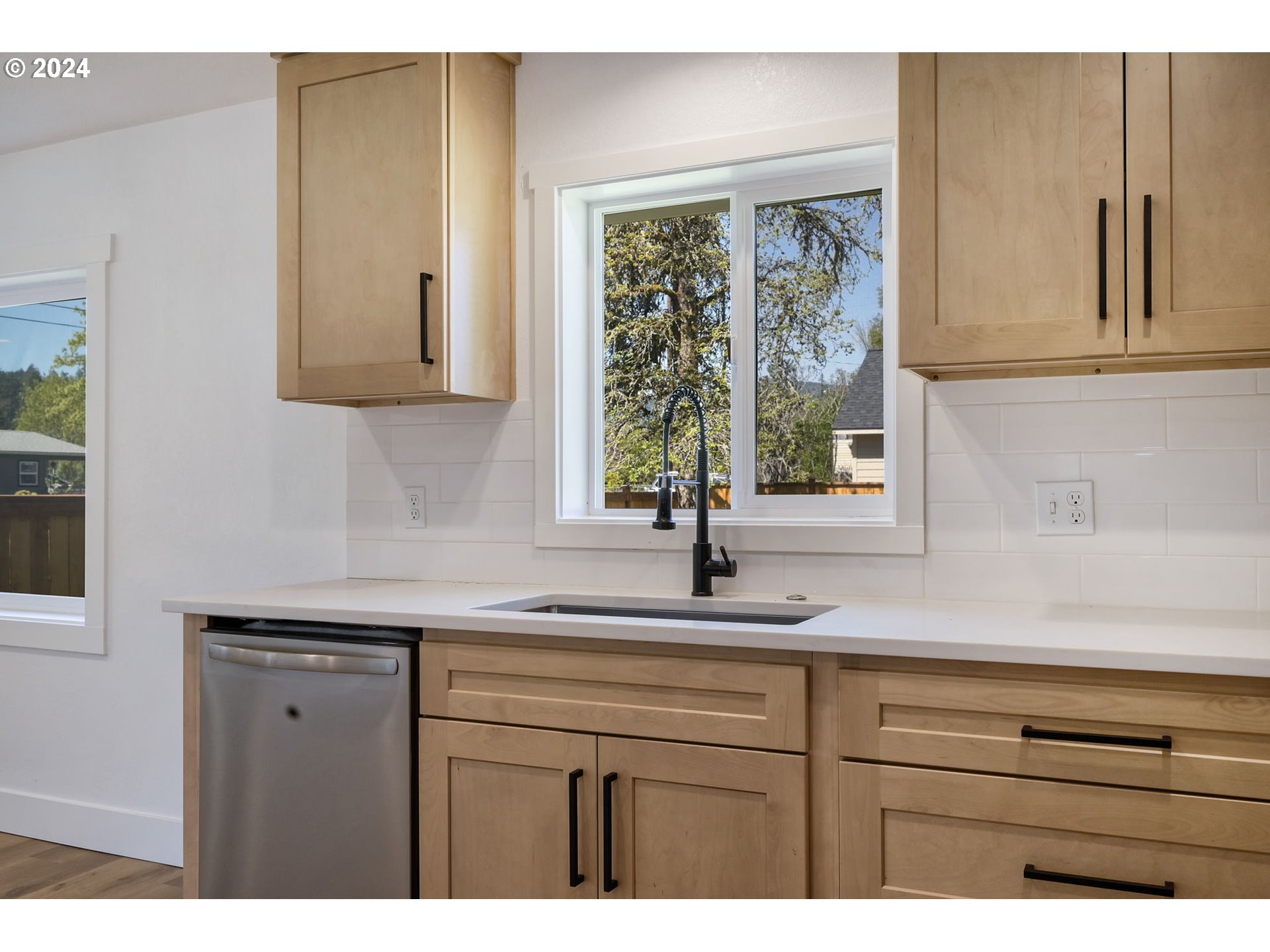 92045 Maple Lane Springfield, OR 97478 - Photo 5 of 21 a kitchen with a sink and cabinets