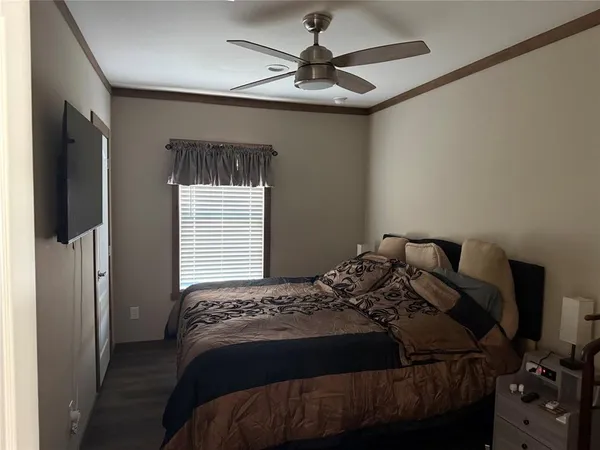 a kitchen with stainless steel appliances granite countertop a stove a refrigerator a sink a dining table and chairs