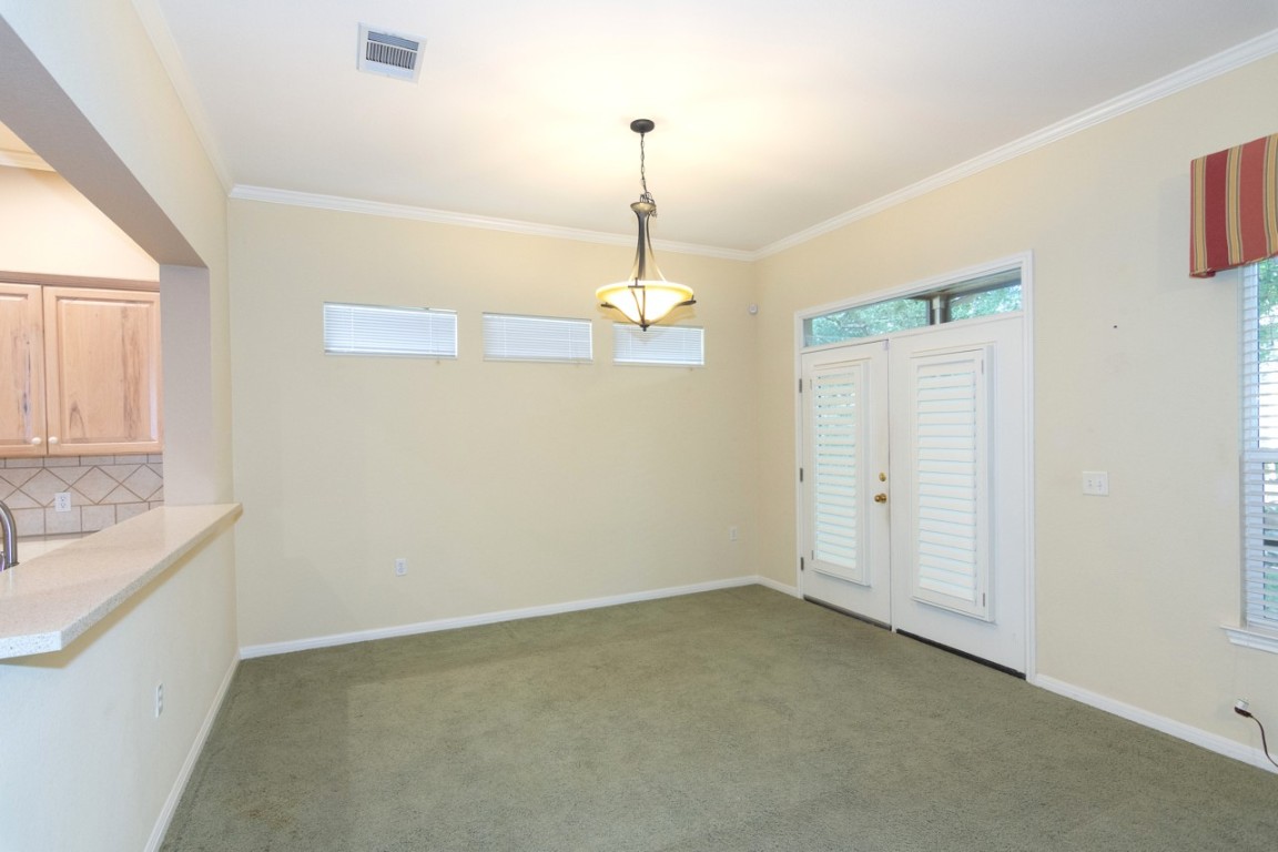 102 Harness Lane Georgetown, TX 78633 - Photo 11 of 32 Use as a second dining or more living framed with french doors overlooking a spacious screened in back porch