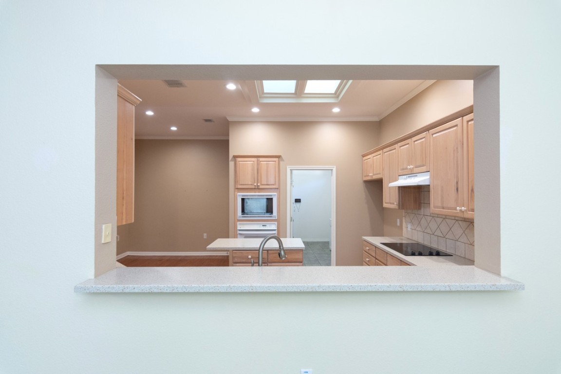 102 Harness Lane Georgetown, TX 78633 - Photo 12 of 32 Peek in to see what is happening in the kitchen