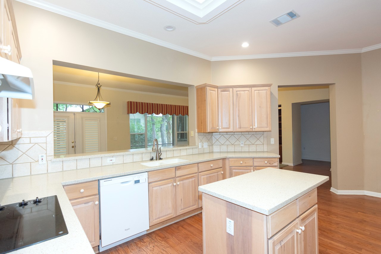 102 Harness Lane Georgetown, TX 78633 - Photo 13 of 32 a kitchen with a sink a counter top space and appliances