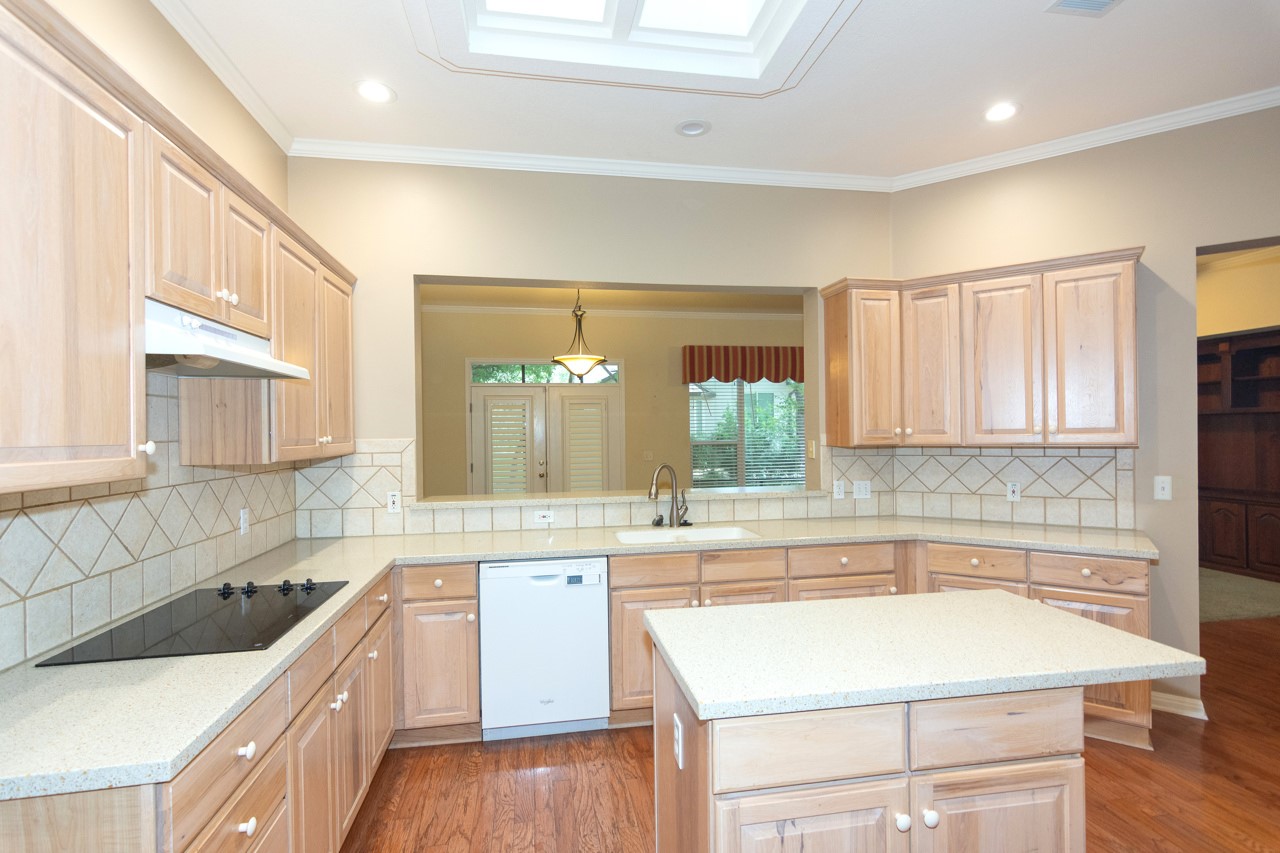 102 Harness Lane Georgetown, TX 78633 - Photo 14 of 32 a kitchen with a sink stove and cabinets