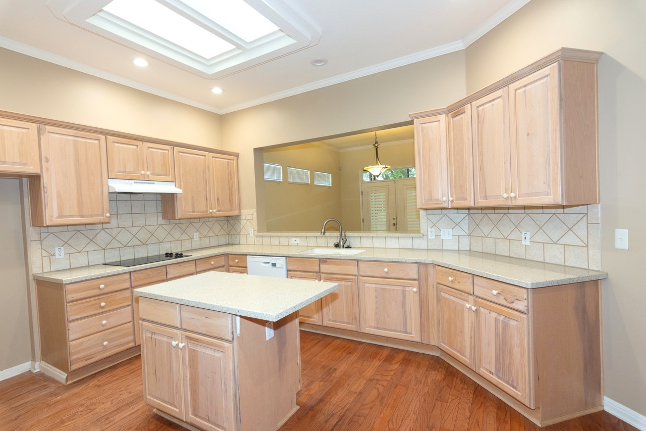 102 Harness Lane Georgetown, TX 78633 - Photo 16 of 32 a kitchen with a sink stove and cabinets