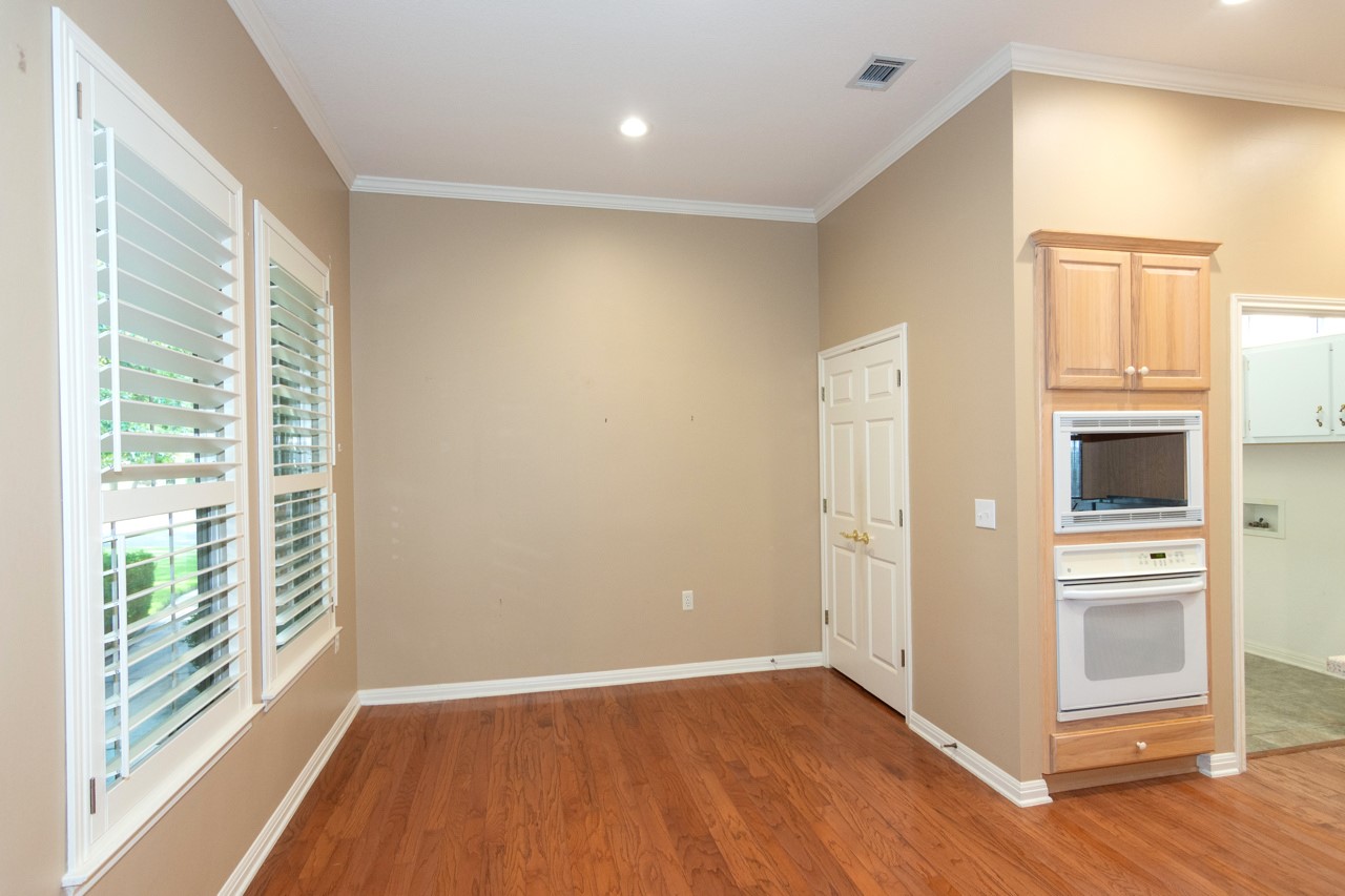 102 Harness Lane Georgetown, TX 78633 - Photo 17 of 32 a view of empty room with wooden floor and fan