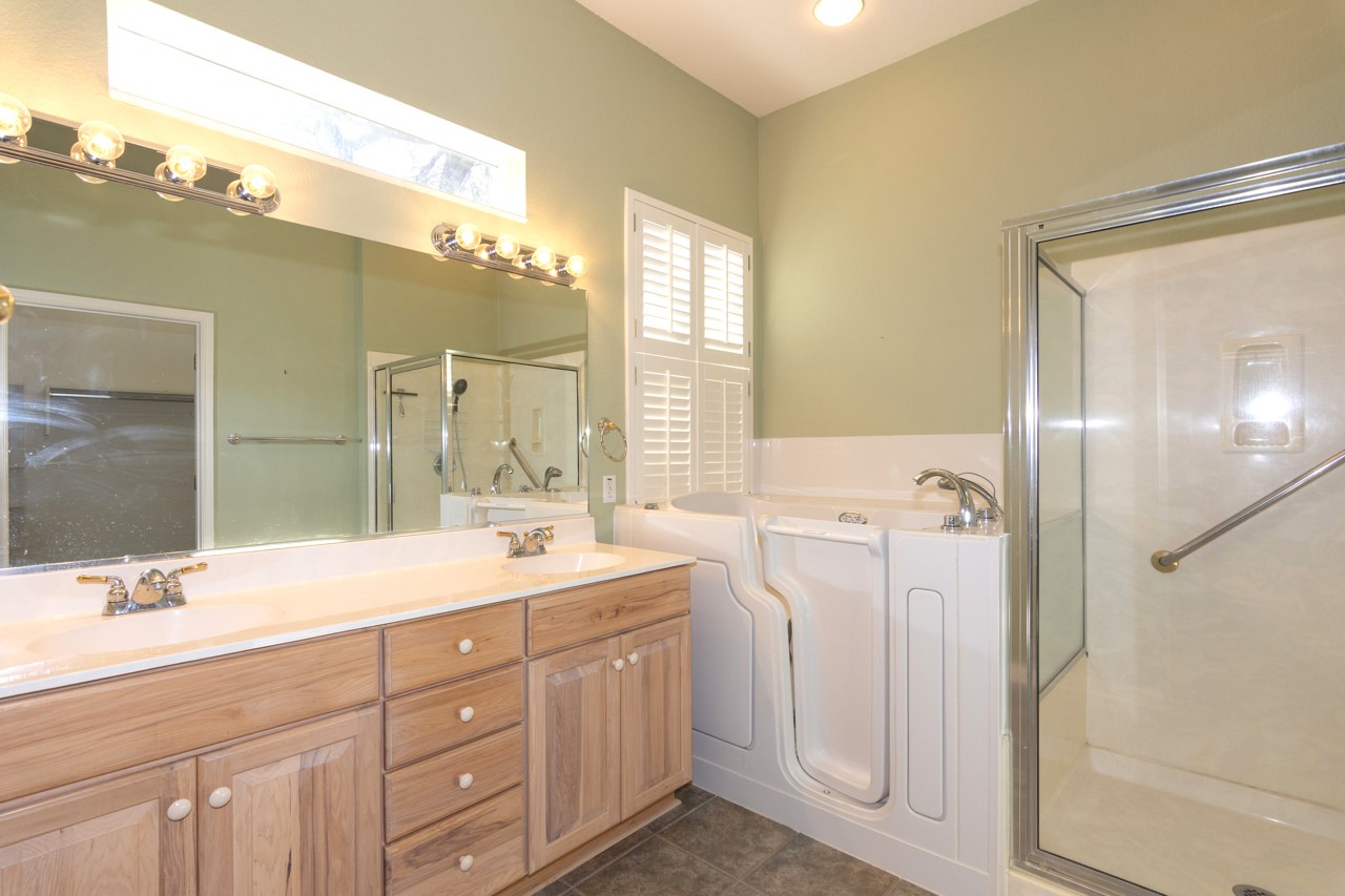 102 Harness Lane Georgetown, TX 78633 - Photo 22 of 32 a spacious bathroom with a double vanity sink mirror and double