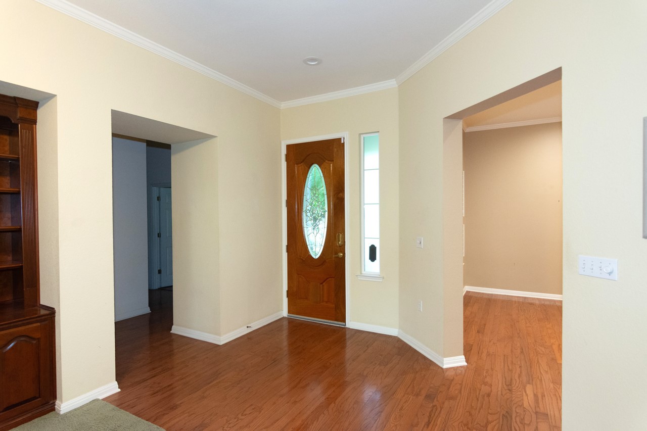 102 Harness Lane Georgetown, TX 78633 - Photo 7 of 32 a view of a room with wooden floor and mirror