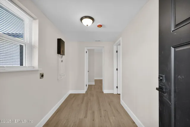 a view of a livingroom with wooden floor