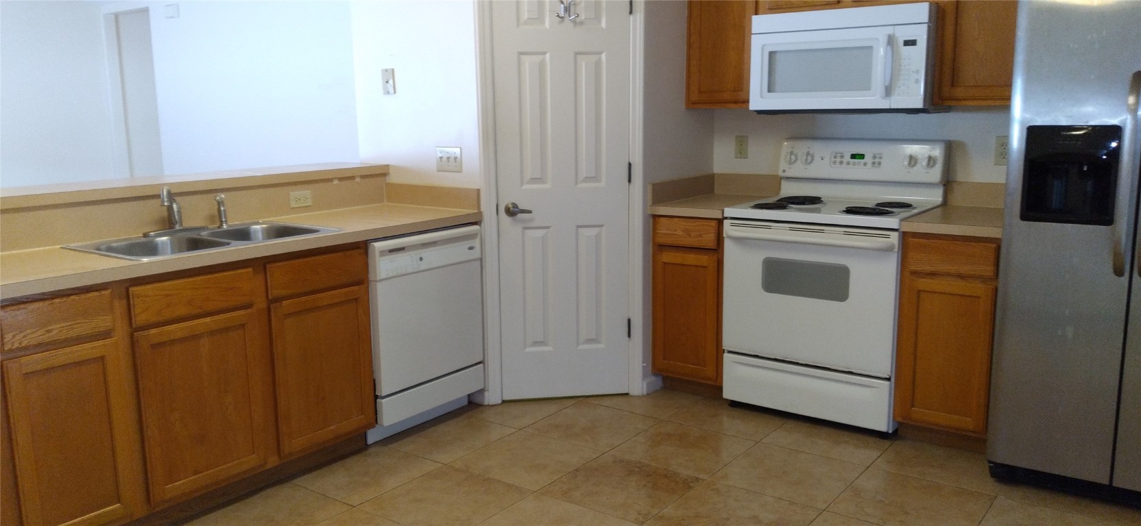 96050 Starlight Lane Yulee, FL 32097 - Photo 6 of 18 a utility room with cabinets washer and dryer