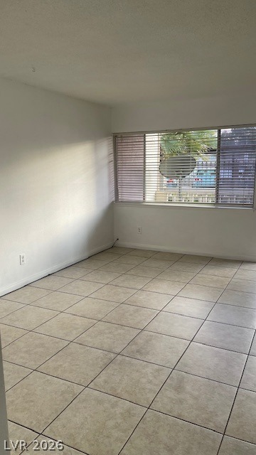 350 East Desert Inn Road, Unit B103 Las Vegas, NV 89109 - Photo 15 of 22 A well-lit interior space features ample natural illumination and durable tile flooring.