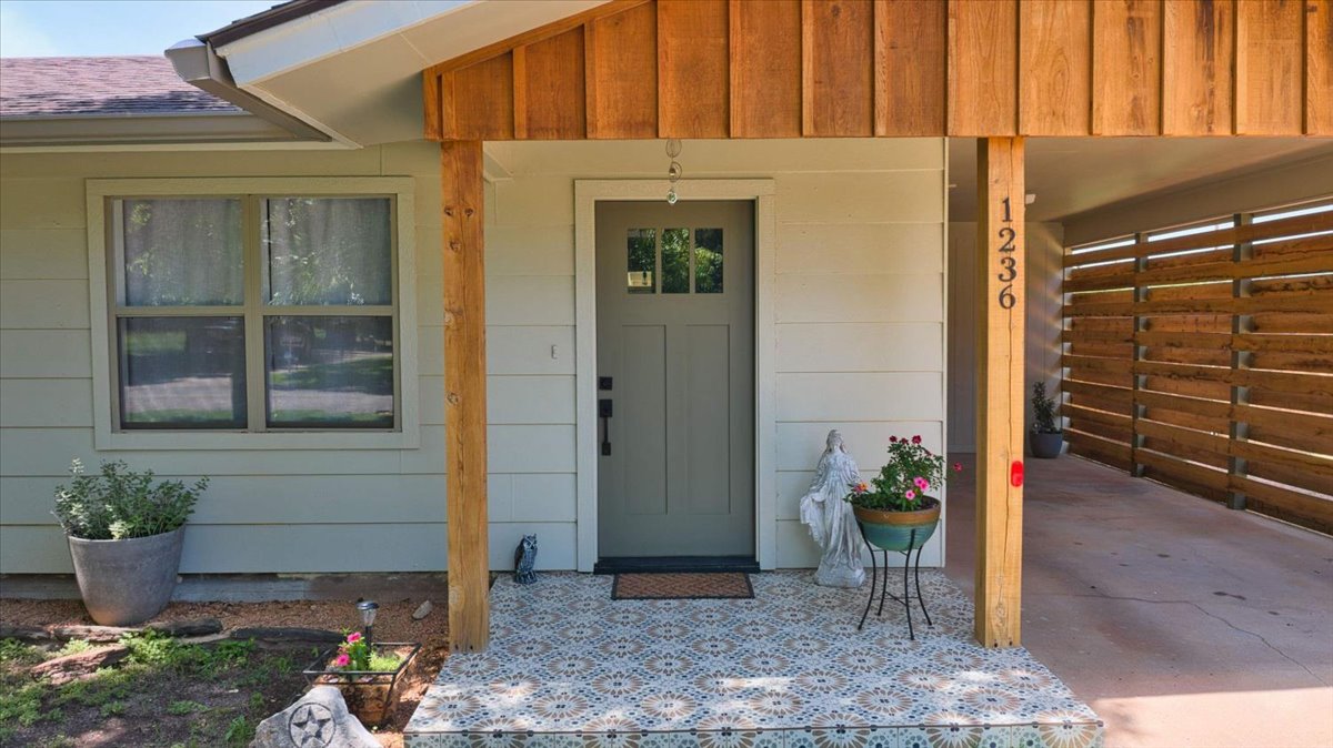 1236 Martin Street Mason, TX 76856 - Photo 2 of 40 A charming entry with patterned tile flooring welcomes visitors to this inviting home.