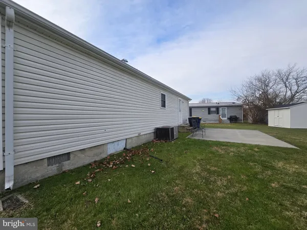 a view of a back yard of the house