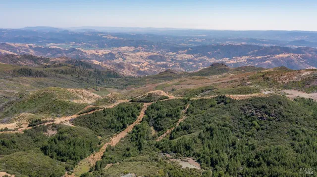 a view of mountains and valleys