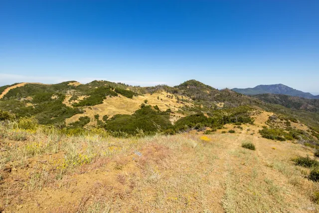 a view of a ocean with a mountain