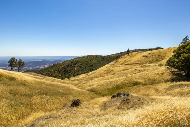 a view of mountain view with mountains in the background