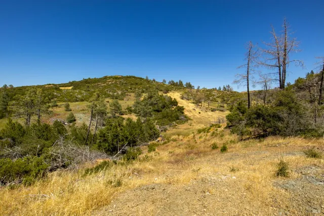 a view of a large body of water with a building in background