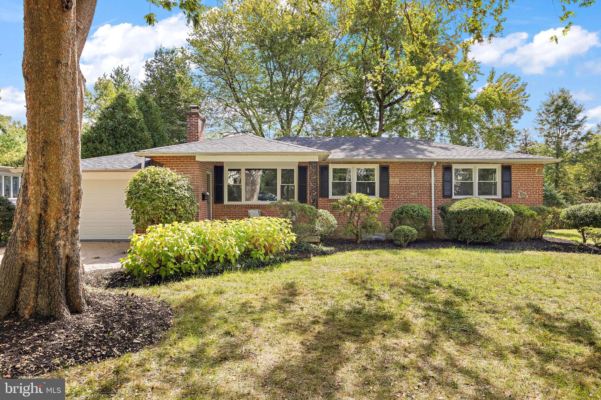 4404 Miller Road Wilmington, DE 19802 - Photo 1 of 38 a front view of a house with a yard and potted plants