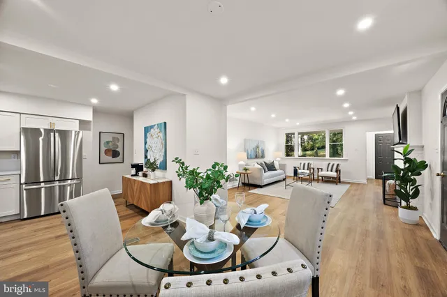 a kitchen with stainless steel appliances granite countertop a refrigerator stove a sink and dishwasher