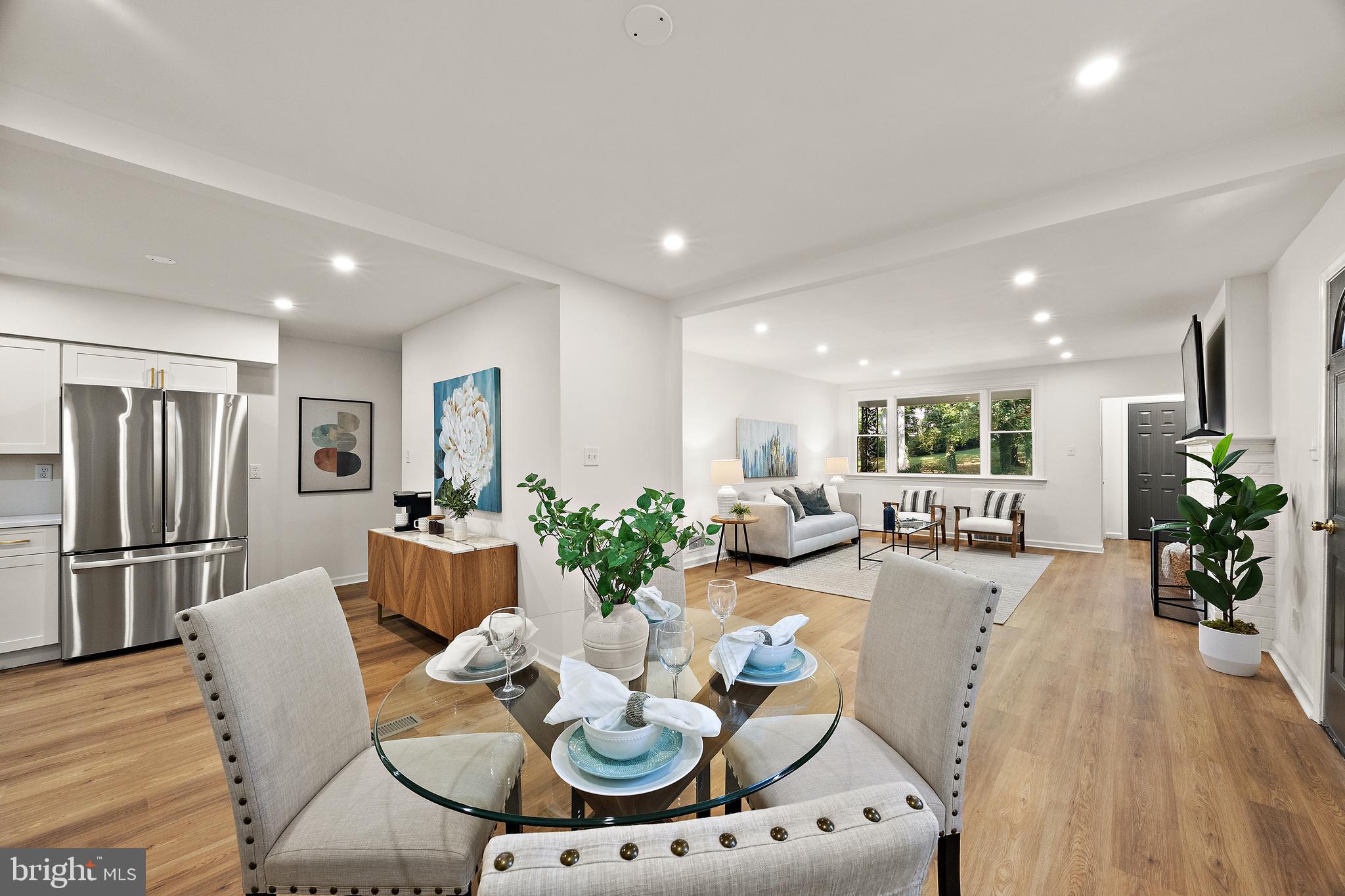 4404 Miller Road Wilmington, DE 19802 - Photo 11 of 38 a living room with furniture a large window and stainless steel appliances