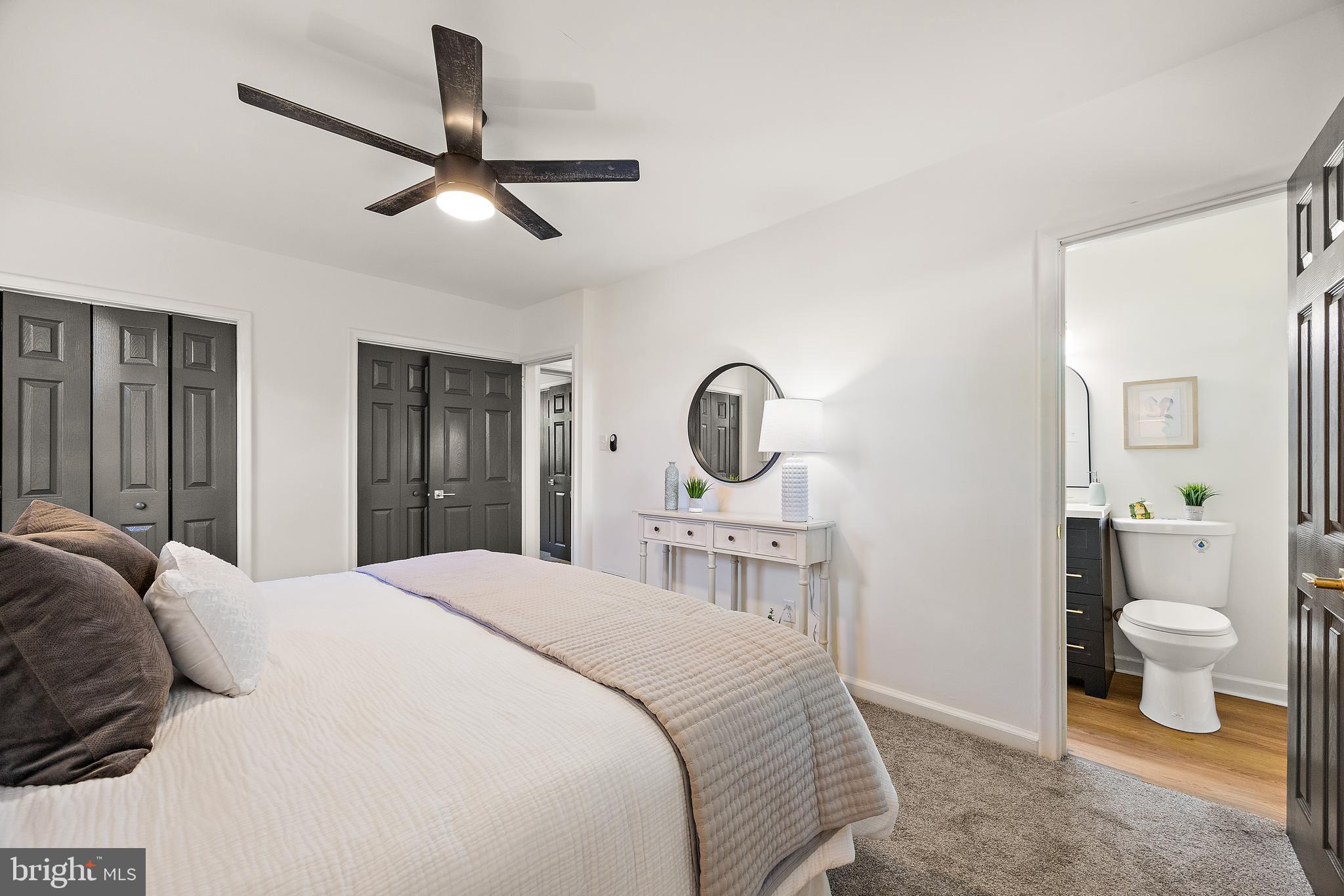 4404 Miller Road Wilmington, DE 19802 - Photo 19 of 38 a bedroom with a bed and a chandelier