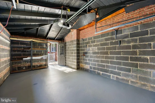 a view of a yard with wooden fence