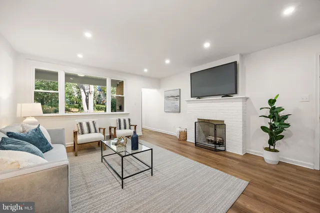 a living room with furniture a fireplace