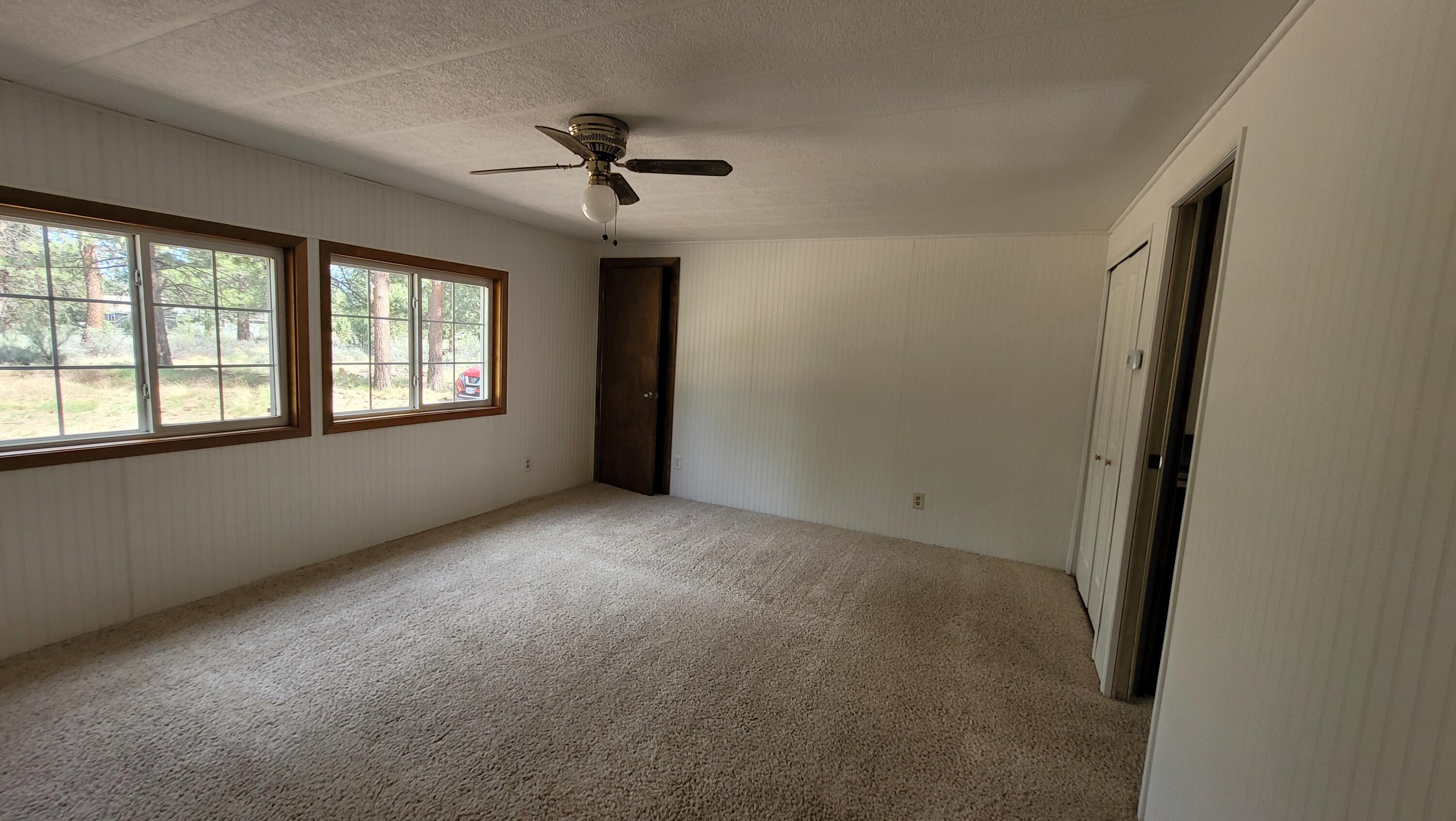 19724 Buck Canyon Road Bend, OR 97702 - Photo 27 of 38 Master bedroom has a huge walk in closet.