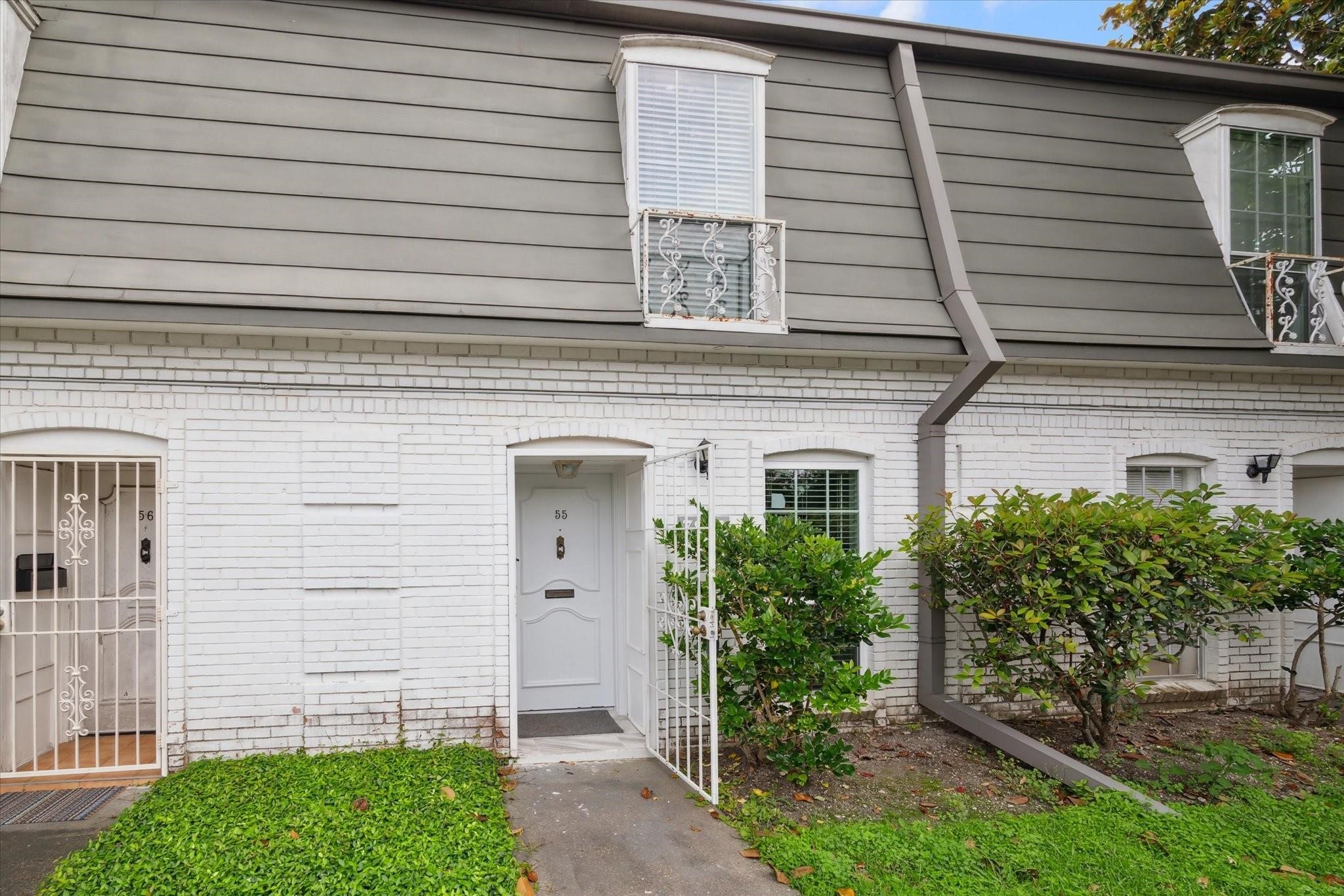 7821 Rue St Cyr Street, Unit 55 Houston, TX 77074 - Photo 16 of 16 Charming exterior within the gated Maison de Ville community.