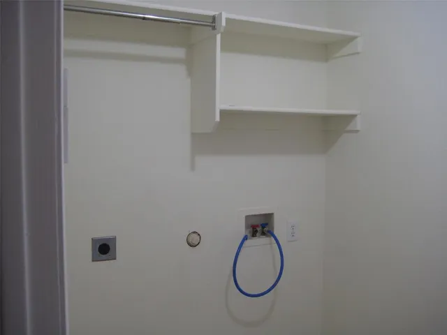 a view of a brick wall and a window