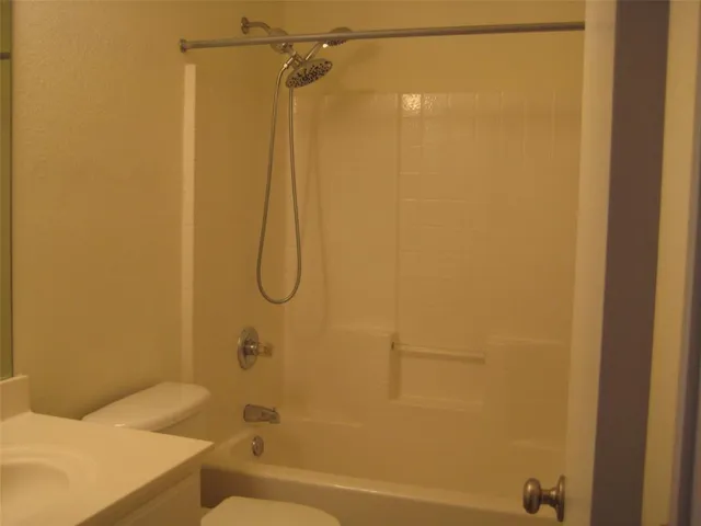 an empty room with wooden floor and a window