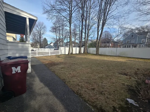a view of a backyard of the house