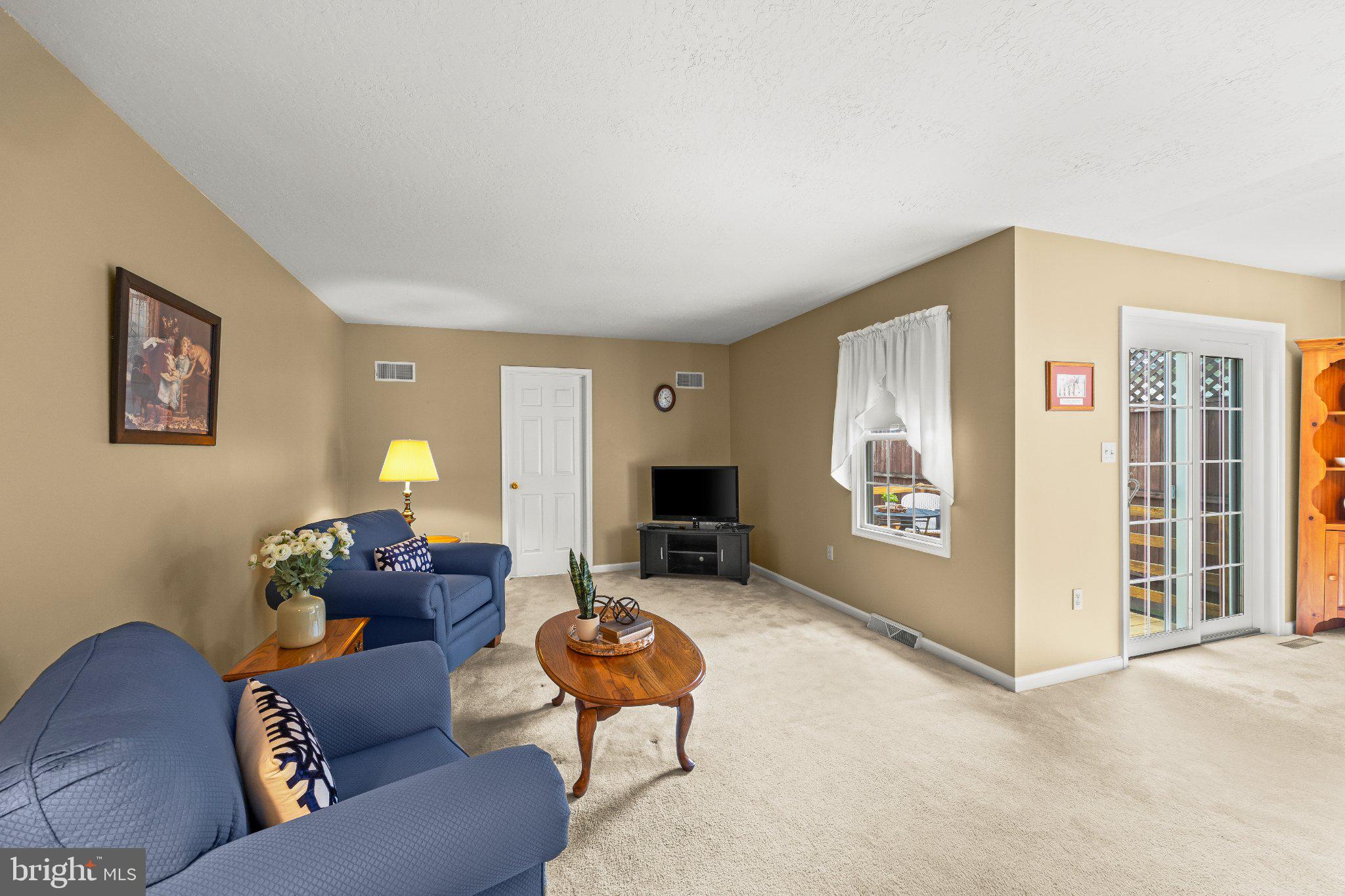 443 Crosswinds Drive Lititz, PA 17543 - Photo 9 of 26 a living room with furniture and a flat screen tv