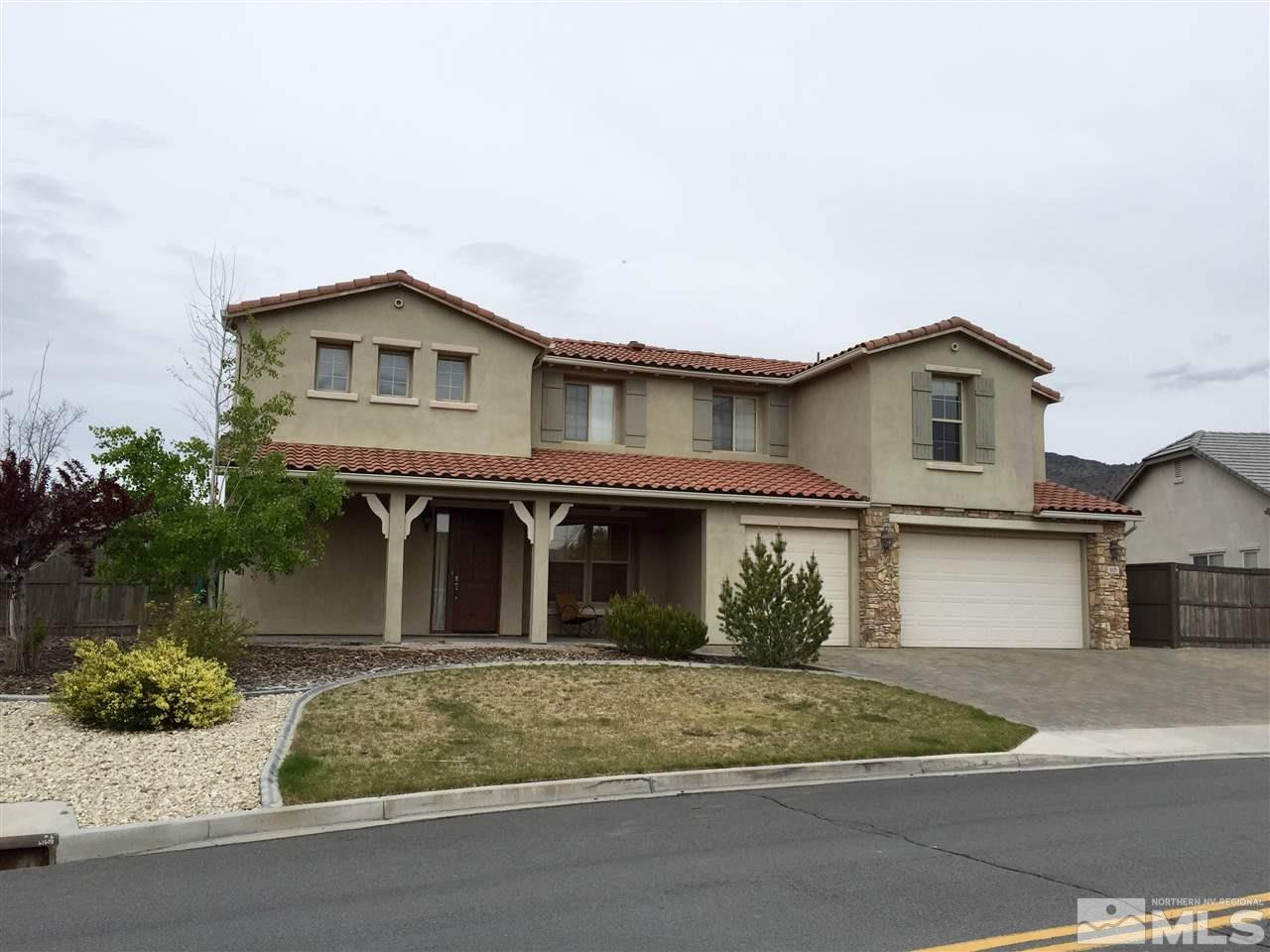 615 Ubaldo Court Reno, NV 89521 - Photo 1 of 1 a front view of a house with garage