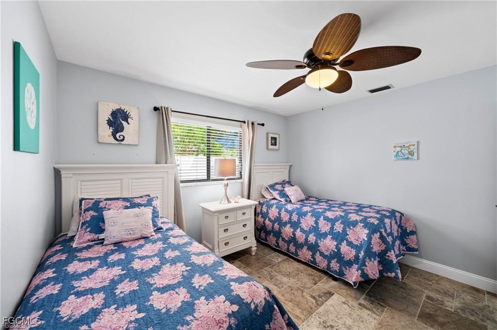 521 102nd Avenue North Naples, FL 34108 - Photo 20 of 25 a bedroom with bed and window