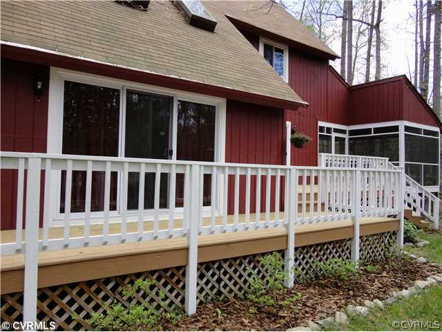 a view of a house with wooden fence