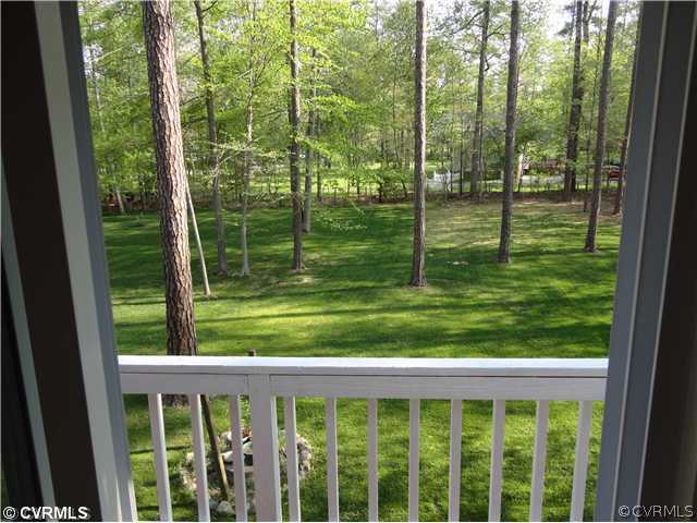 6310 Glebe Point Road Chesterfield, VA 23838 - Photo 11 of 12 a view of a wooden deck next to a yard