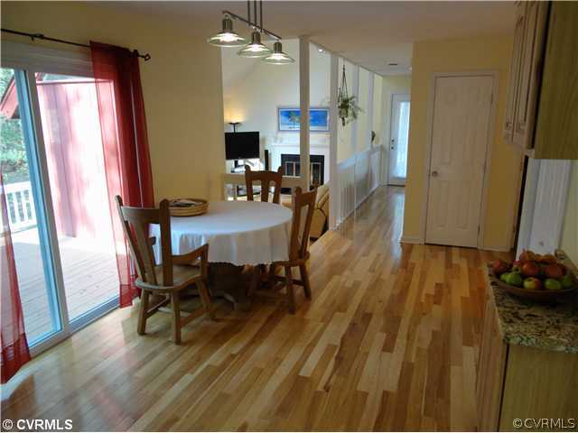 6310 Glebe Point Road Chesterfield, VA 23838 - Photo 7 of 12 a view of a dining room with furniture window and wooden floor