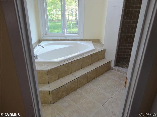 6310 Glebe Point Road Chesterfield, VA 23838 - Photo 10 of 12 a bathroom with bathtub and window