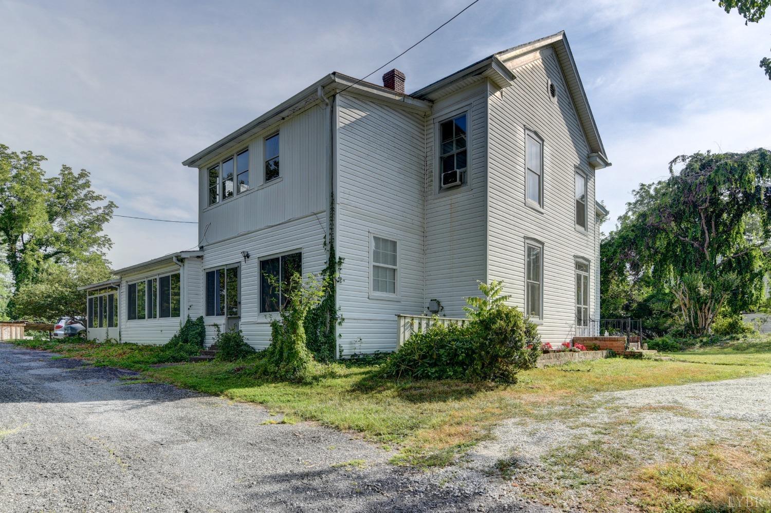 329 South Main Street Amherst, VA 24521 - Photo 43 of 49 a view of a white house next to a yard