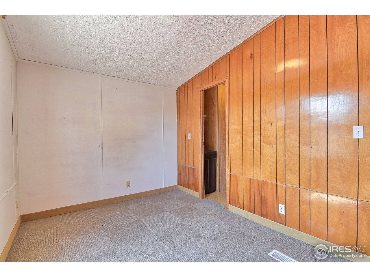 5510 Vallejo Street Denver, CO 80221 - Photo 12 of 22 a view of an empty room with wooden floor