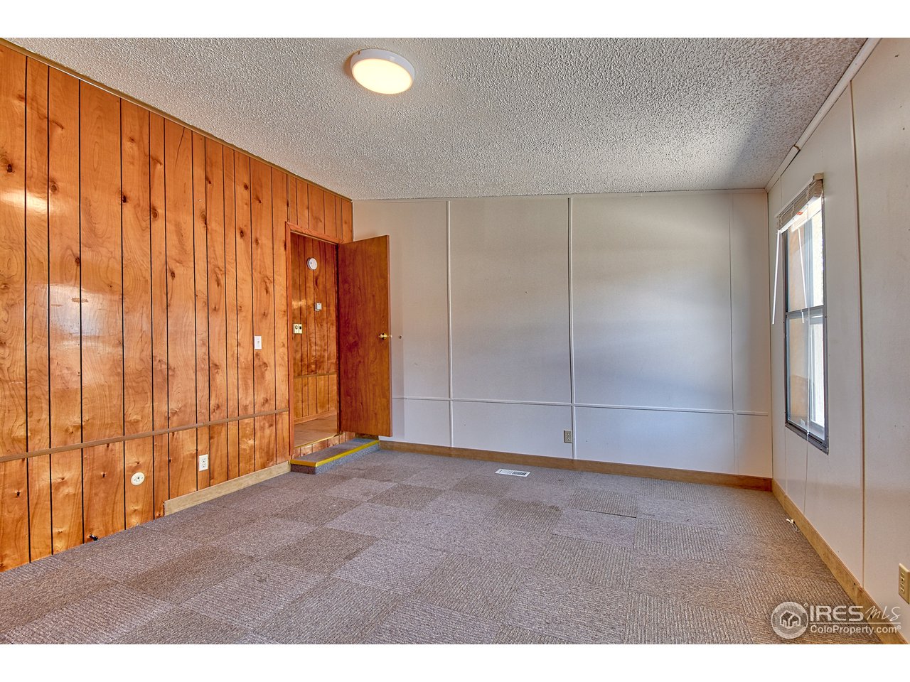5510 Vallejo Street Denver, CO 80221 - Photo 13 of 22 a view of an empty room with a window
