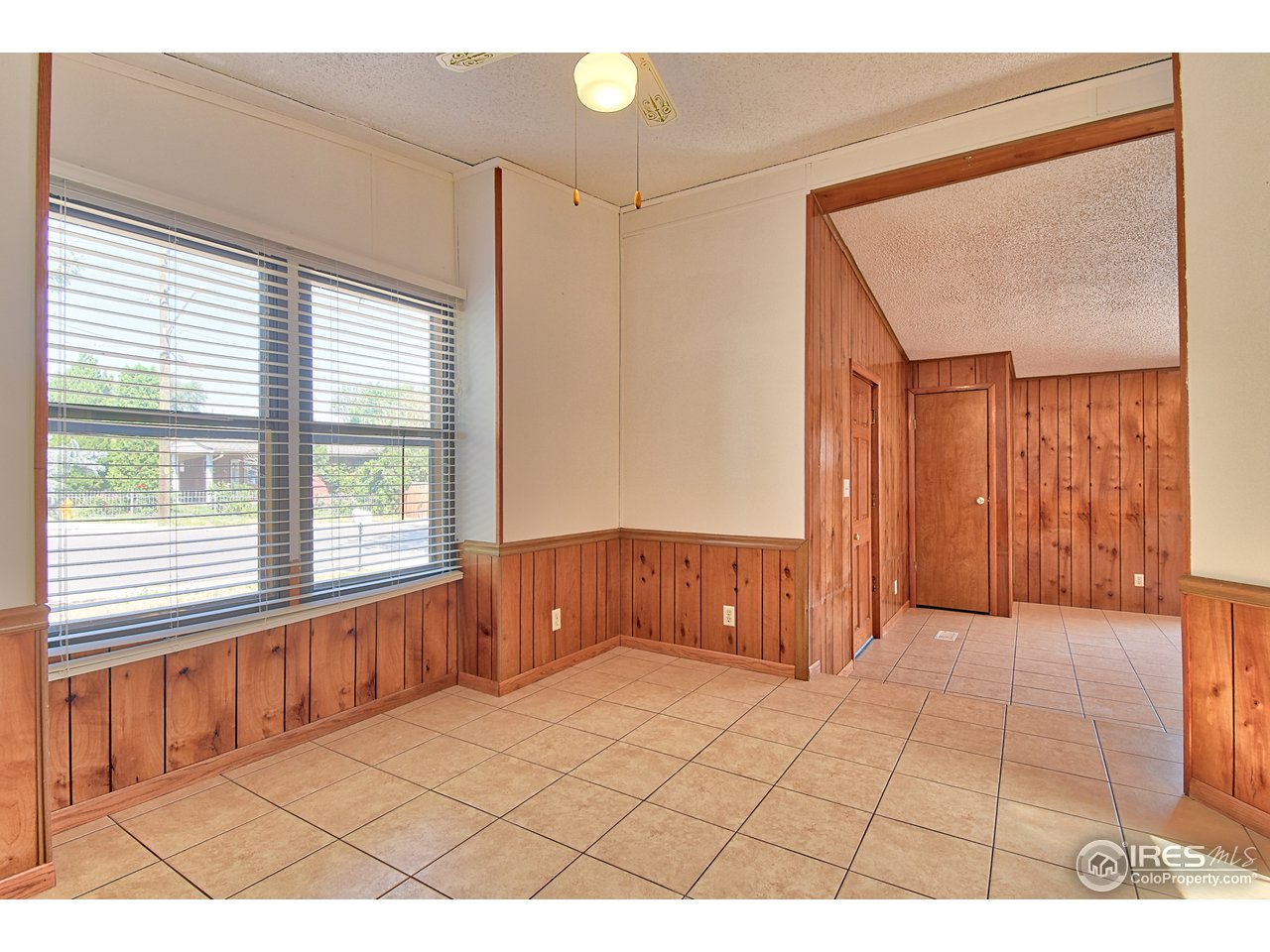 5510 Vallejo Street Denver, CO 80221 - Photo 14 of 22 a view of an empty room with a window
