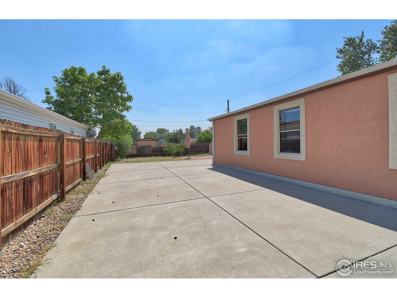 5510 Vallejo Street Denver, CO 80221 - Photo 20 of 22 a backyard of a house with lots of green space