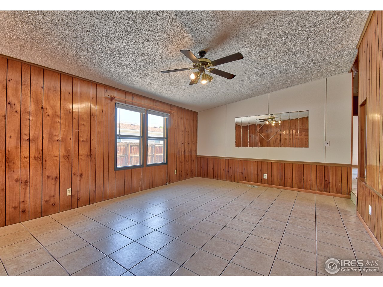5510 Vallejo Street Denver, CO 80221 - Photo 3 of 22 a view of an empty room with a window